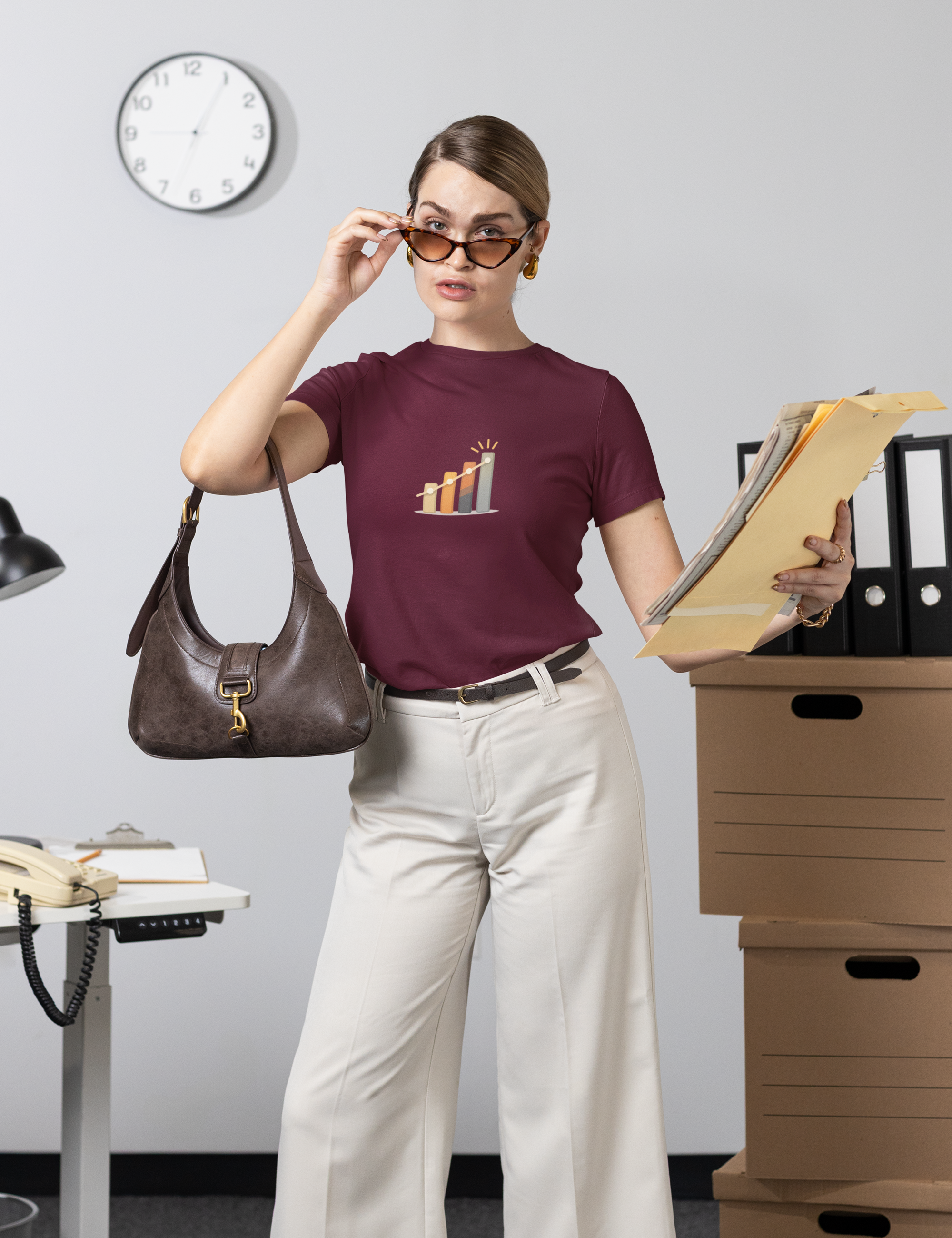 bella-canvas-t-shirt-mockup-of-a-woman-holding-papers-at-an-office-m55708_1.png