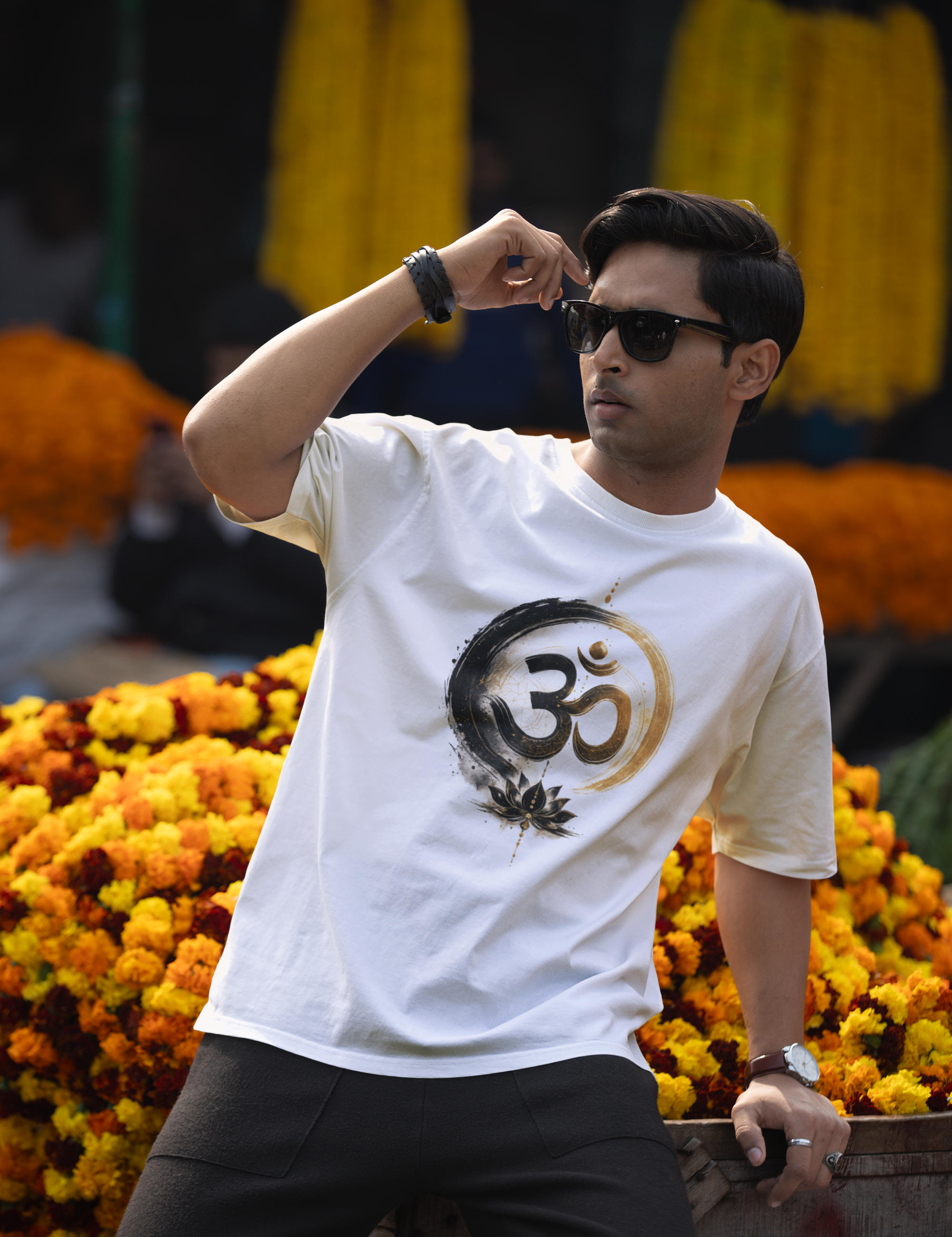 blinkstore-t-shirt-mockup-of-a-cool-man-posing-against-some-flowers-in-a-street-market-m37567.png