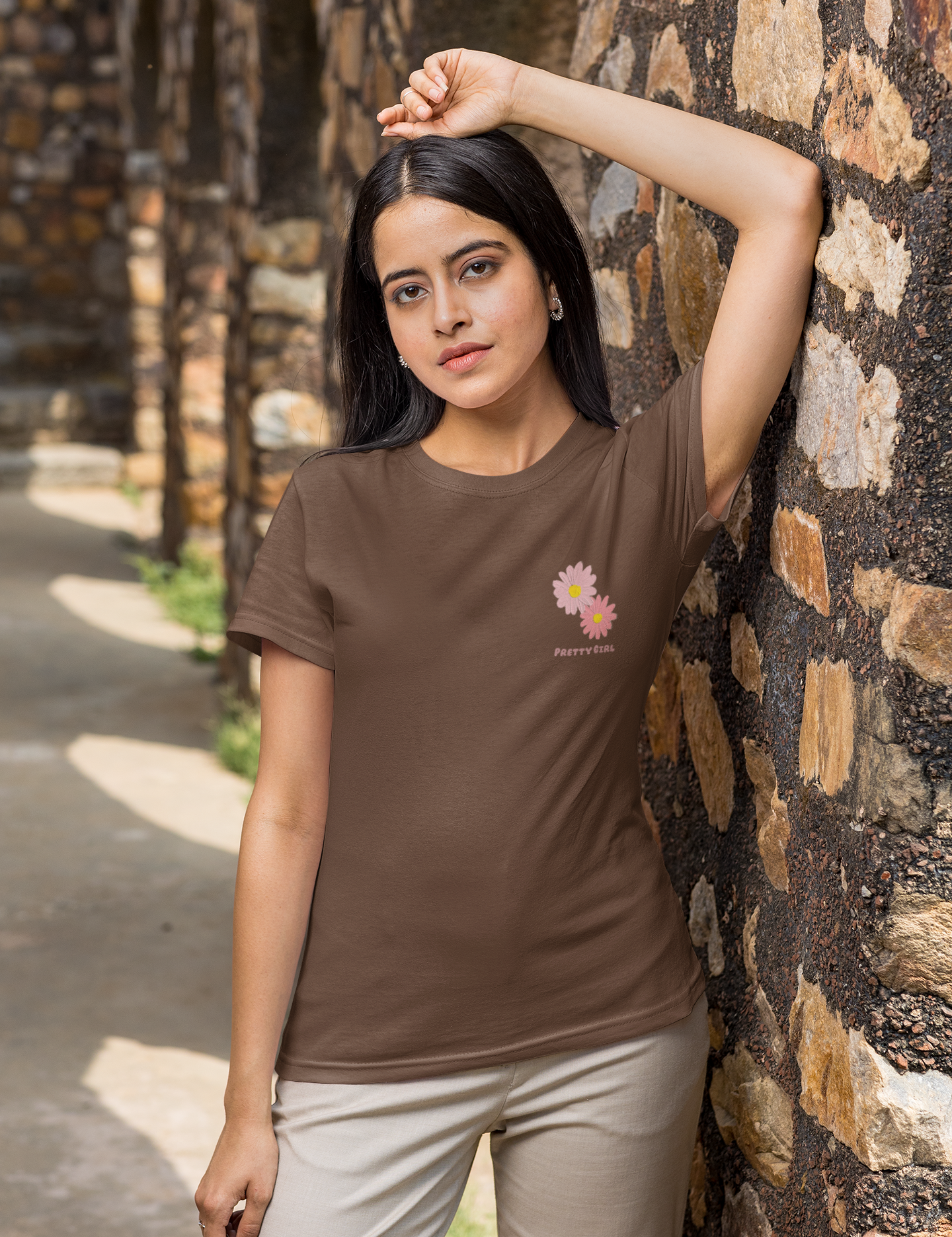 round-neck-tee-mockup-of-a-woman-leaning-over-a-rock-wall-m25834.png
