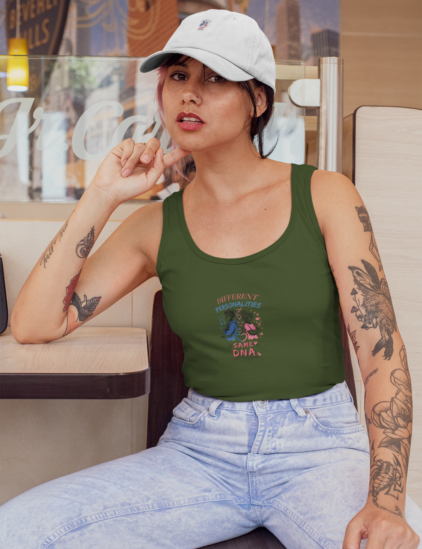 tank-top-mockup-of-a-woman-wearing-a-dad-hat-at-a-restaurant-31192.png