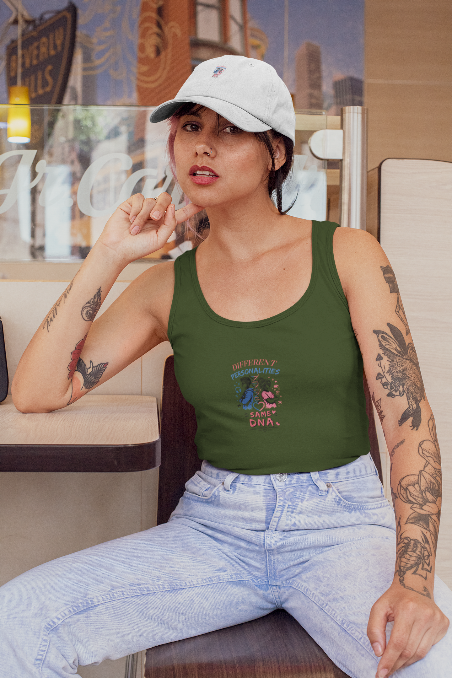 tank-top-mockup-of-a-woman-wearing-a-dad-hat-at-a-restaurant-31192.png